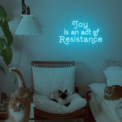 Joy is an act resistance neon sign